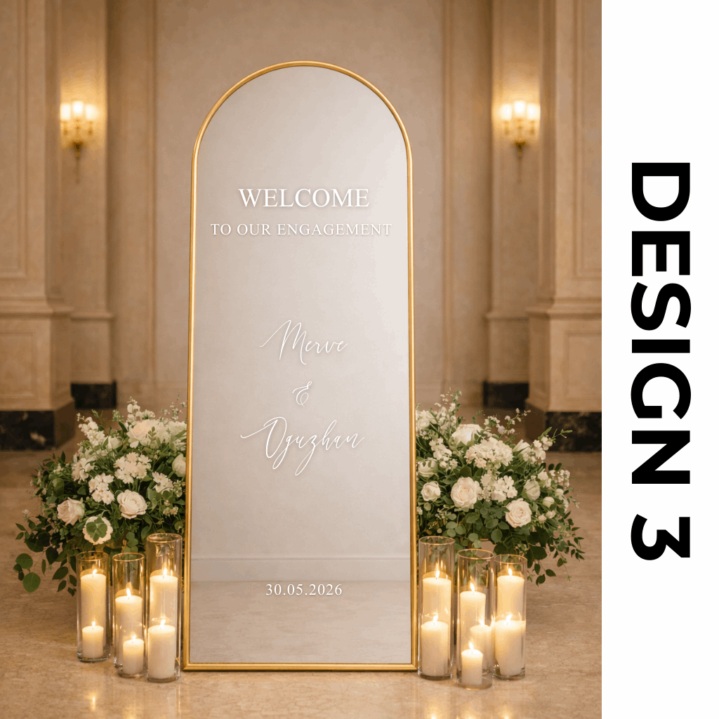 Decorative mirror with personalized text in a room with flowers and candles.