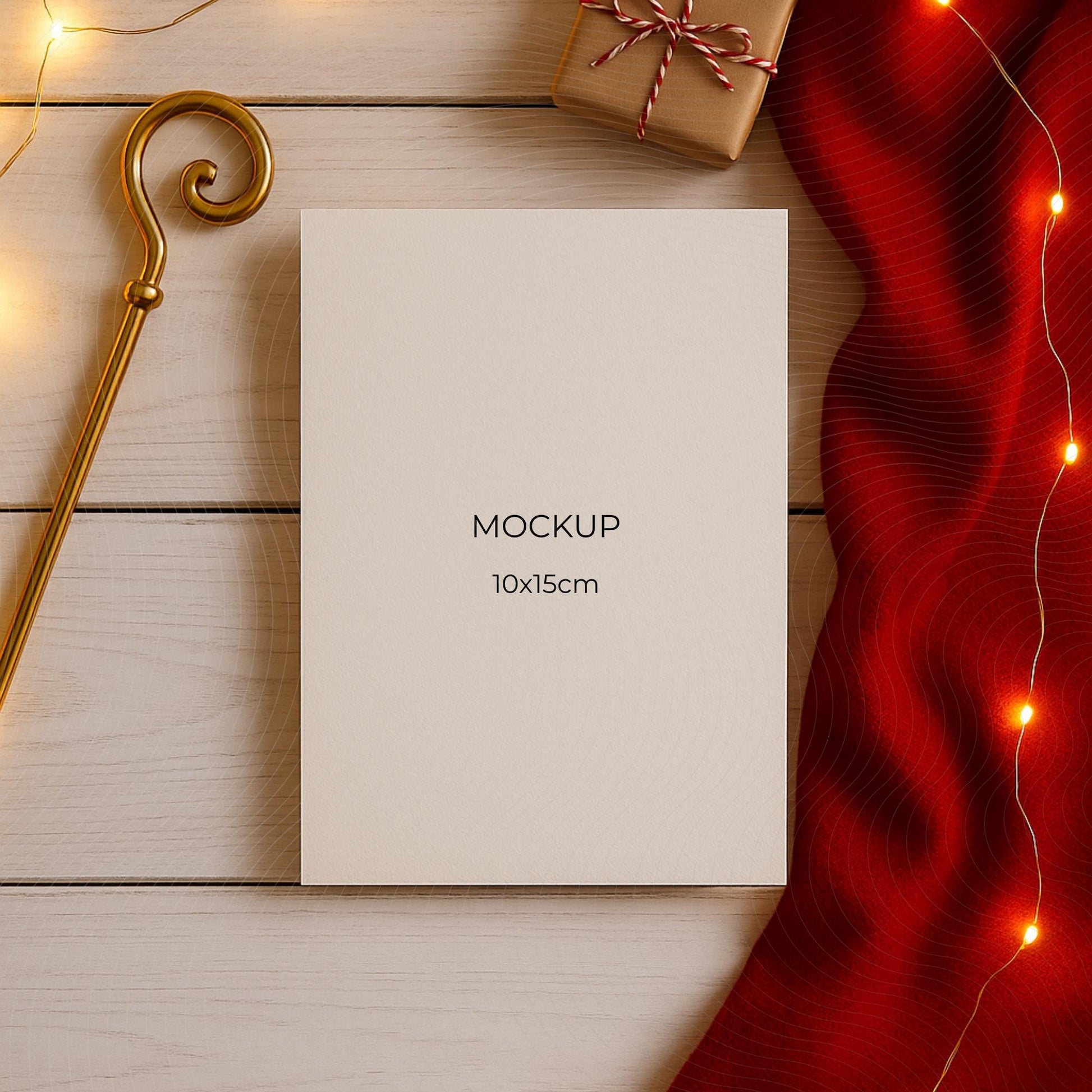 White card with 'MOCKUP' text on a wooden surface with decorative elements
