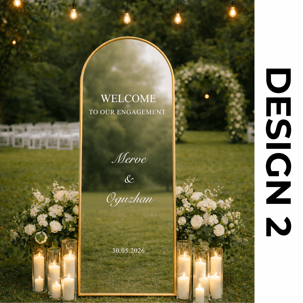 Decorative mirror with personalized text in a garden setting, surrounded by flowers and candles.